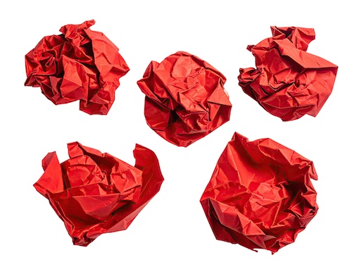 Five pieces of crumpled red paper